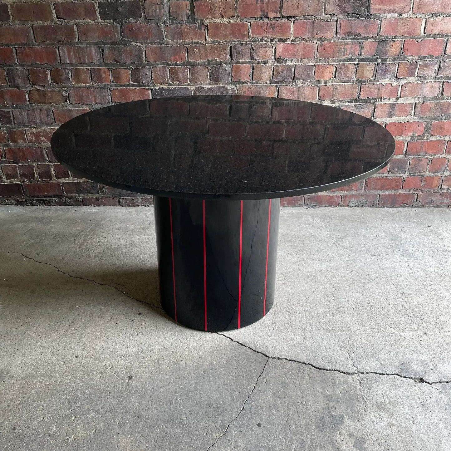 1980s Black Round Stone Table Top With Red Strips on Black Laminate Base Round
