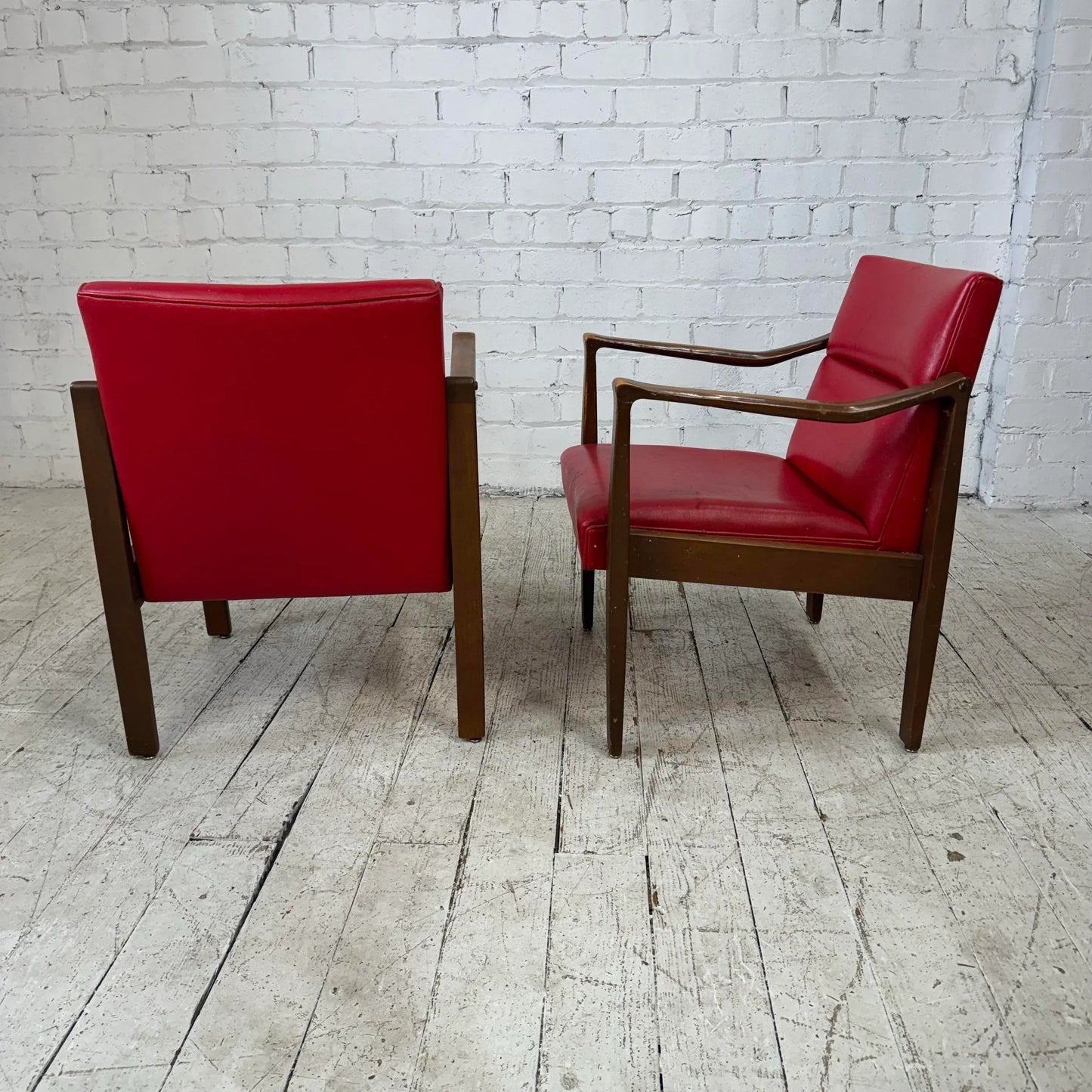 Mid Century Modern Pair of Red Vinyl Arm Chairs