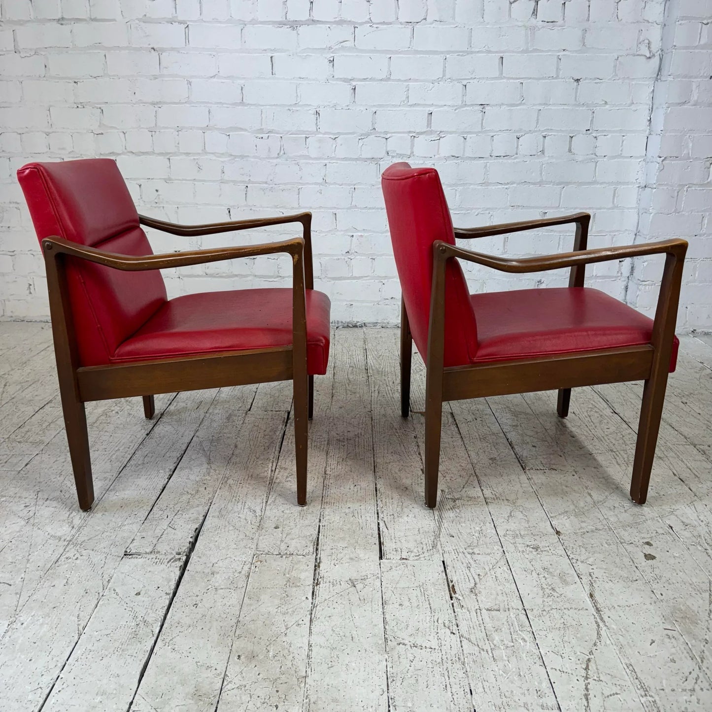 Mid Century Modern Pair of Red Vinyl Arm Chairs