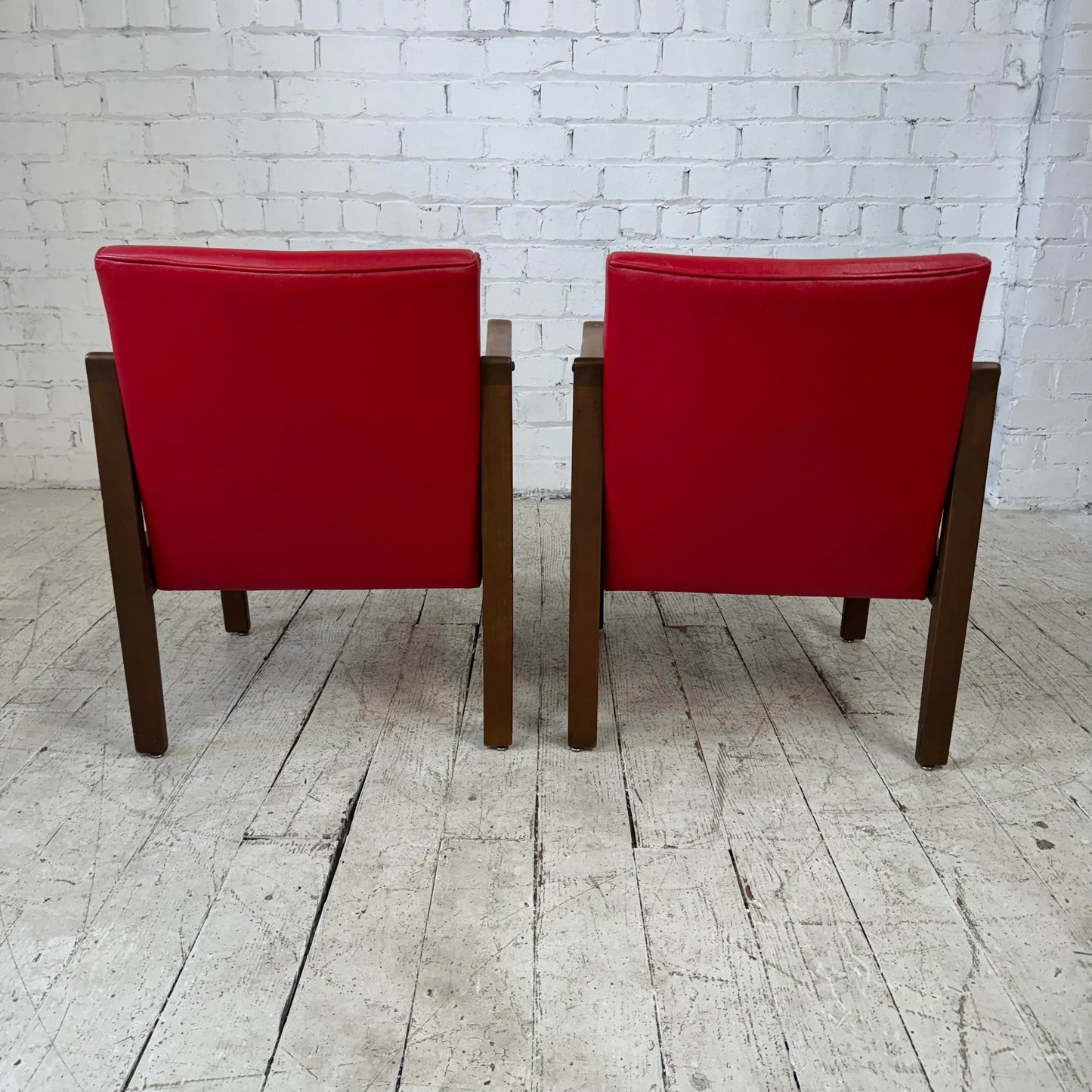 Mid Century Modern Pair of Red Vinyl Arm Chairs