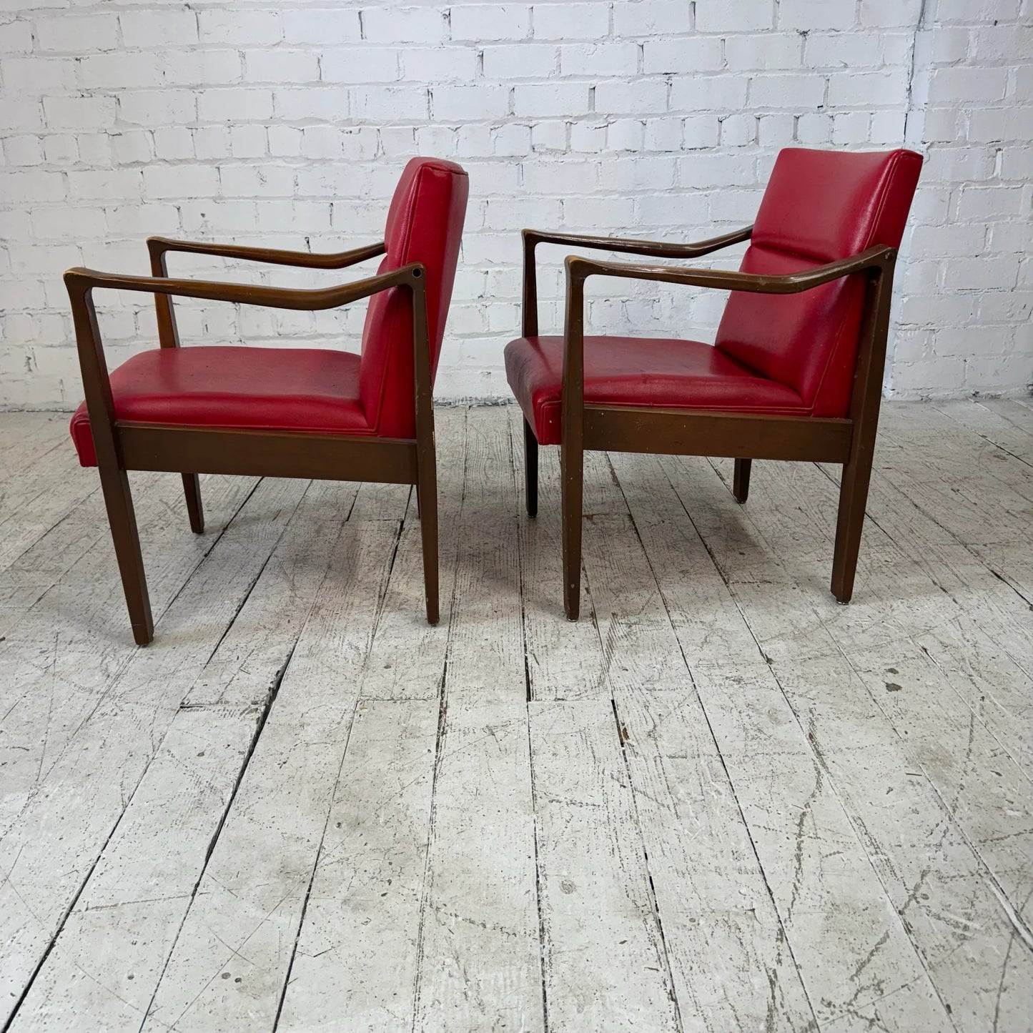 Mid Century Modern Pair of Red Vinyl Arm Chairs