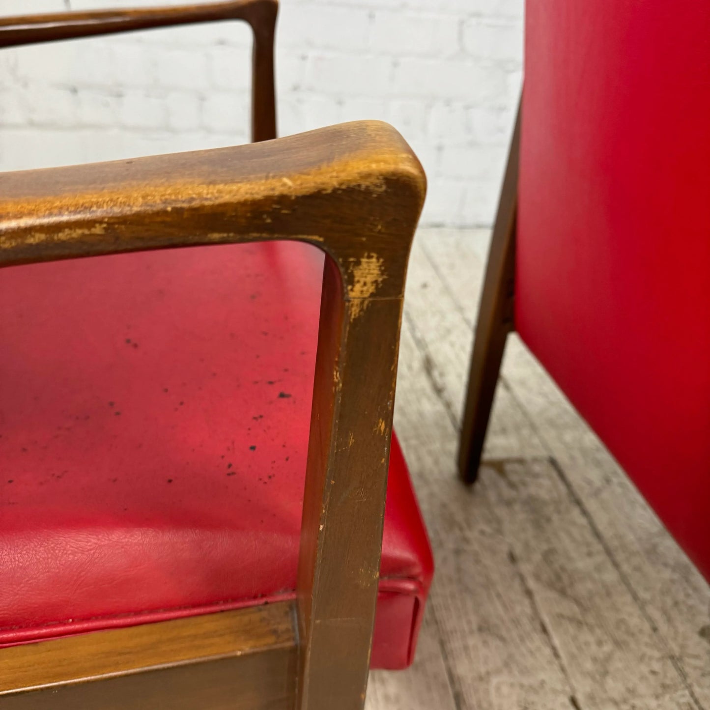 Mid Century Modern Pair of Red Vinyl Arm Chairs
