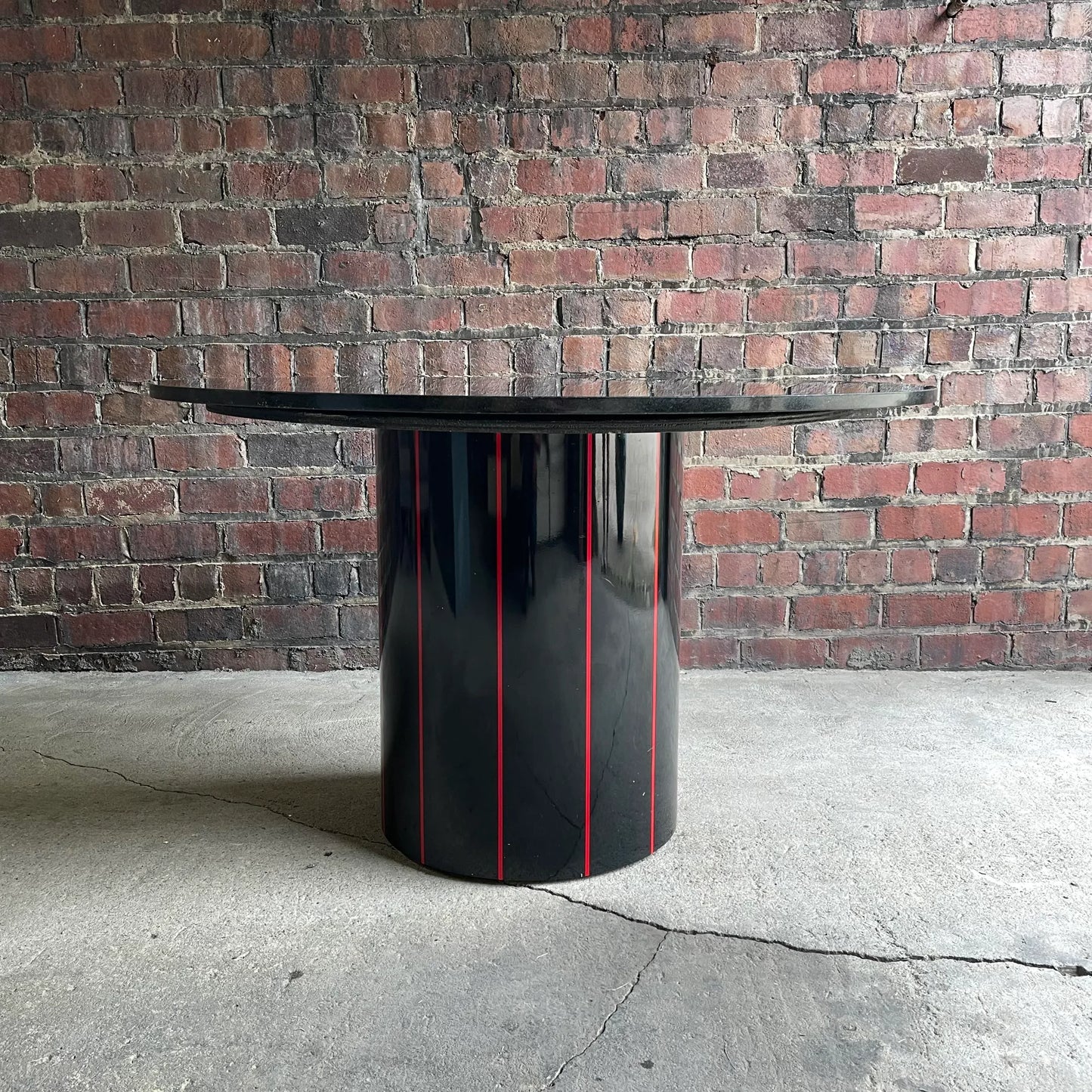 1980s Black Round Stone Table Top With Red Strips on Black Laminate Base Round