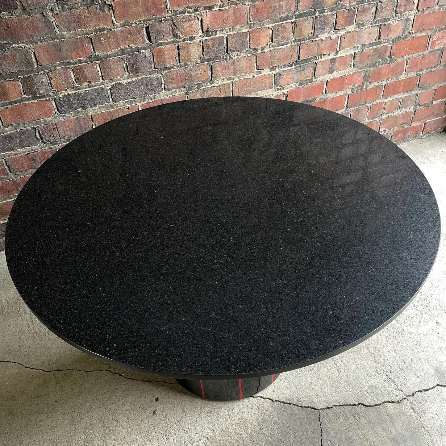 1980s Black Round Stone Table Top With Red Strips on Black Laminate Base Round
